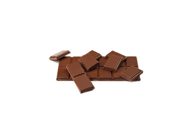 Milk organic chocolate bar and pieces isolated over white background.
