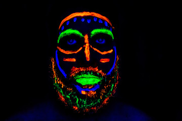 Man with neon makeup for a Neon Party For halloween
