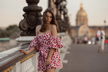 Beautiful girl is walking in Paris, France, summer time