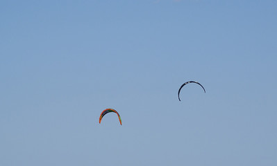 Two kite surfers over the Mediterranean Sea 