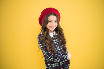 Pure joy. small girl kid with long curly hair. happy girl in french beret. child on yellow...