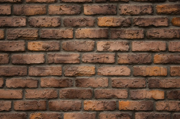 Obraz premium Dark red and yellow brick wall background