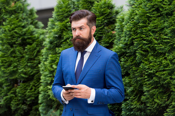Providing feedback. serious businessman with smartphone. agile business. bearded man on business...