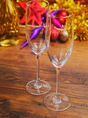 Christmas and new year's abstract background with decorations and champagne glasses. Selective focus.