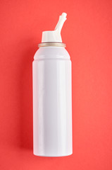 Nasal spray bottle composition, white template bottle on pink background
