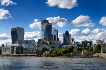 Tower Pier and Tower of London on the River Thames and financial district skyscrapers Walkie Talkie...