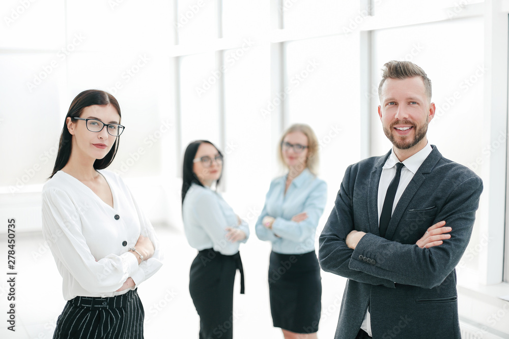 Wall mural group of successful employees standing in the office