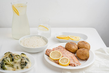 Salmon steak served with baked potato 