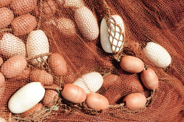 Fishing net with floats. Fishing nets drying on the dock