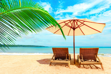 Chairs on the tropical beach near sea, Thailand. Holidays Background.
