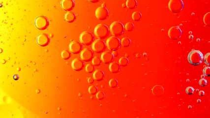 abstract looking oil color moving in a circle. The colors change in the background. Overlay or backdrop animation.