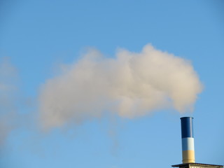 Fireplace releasing large quantities of smoke lost in the atmosphere