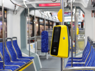 Bus with a validator for self-payment. Fare control without a conductor. Non-cash transport payment. Terminal of payment for travel by transport or bank cards.