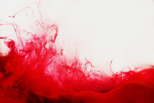 Red paint in the water abstract grunge background like a blood with copy space