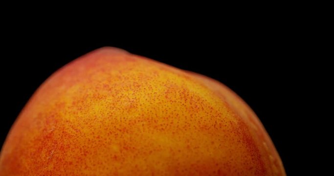 Delicious ripe peach. Macro shooting, the fruit moves around its axis.