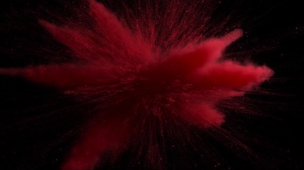 3d render of red powder explosion on black background. Slow motion movement with acceleration in the beginning.