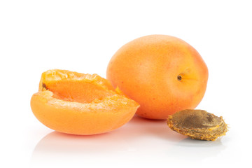 Naklejka na ściany i meble Group of one whole one half of ripe fresh deep orange apricot with a stone isolated on white background