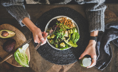 Healthy dinner, lunch setting. Flat-lay of vegan superbowl or Buddha bowl with hummus, vegetable,...