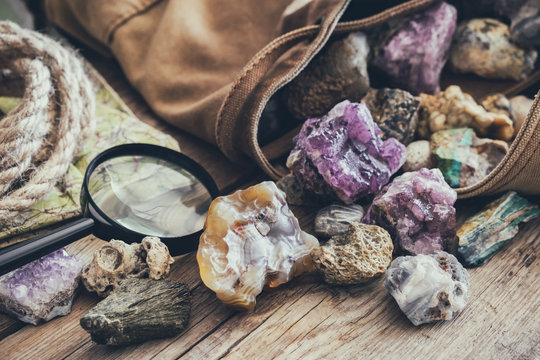 Mineral stones collection and kit of geologist - backpack, map, magnifying glass, rope.