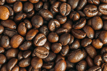 Roasted coffee beans background, macro photo, close up
