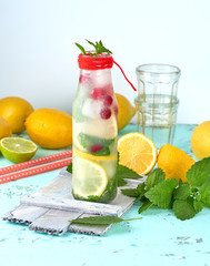 summer refreshing drink lemonade with lemons, cranberry, mint leaves