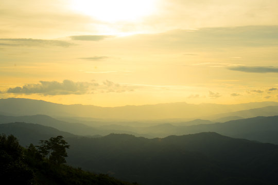 The longitudinal mountains and the setting sun and the forest on Doi Tung