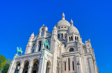 Fototapeta na wymiar The Basilica of the Sacred Heart of Paris, commonly known as Sacré-Cœur Basilica, located in the Montmartre district of Paris, France.