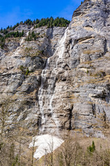 Fototapeta na wymiar Beautiful waterfall in Lauterbrunnen swiss village, , Bernese Oberland, Switzerland, Europe