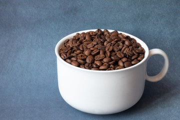  coffee grains in a cup on a beautiful background