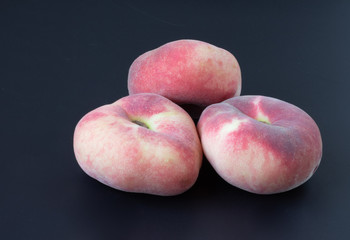 very beautiful peaches on a black background