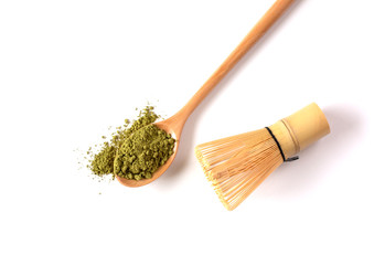 Matcha powder in a wooden spoon with  with a bamboo chasen (whisk). Japanese Culture. Tea Ceremony Concept