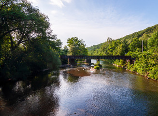 The railroad bridge over Brokenstraw Creek as seen from the bridge on National Forge Road in Irvine, Warren County, Pennsylvania, USA in summertime