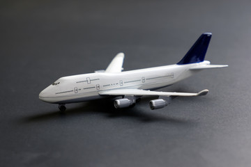 Model commercial airplane on dark color background