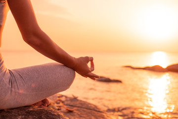 Fototapeta na wymiar Asian girl practice Yoga on the beach Sunrise morning day