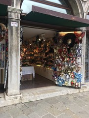 A shop of traditional masks and souvenirs in a small street, Venice Italy 