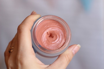 Jar with cosmetic. Face Foundation