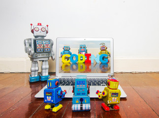 robot kids learn code from a laptop