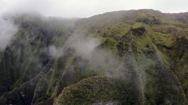 Aerial Dolly Movement over Cathedrals and Ridges of the Na Pali Coast in Hawaii, in an Open Door Helicopter.