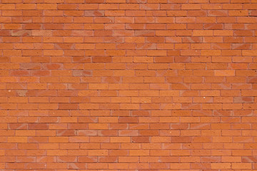 Fototapeta na wymiar Traditional vintage reddish orange brick wall texture background with weathered and worn bricks