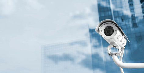 CCTV camera in the city with copy space - obrazy, fototapety, plakaty