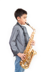 Fototapeta premium Little asian musician boy playing saxophone instrument