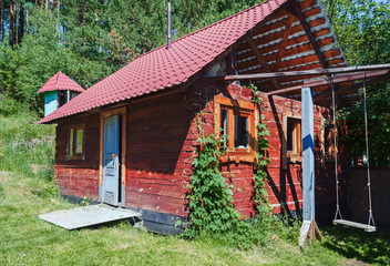 Fototapeta na wymiar wooden house sauna in the forest