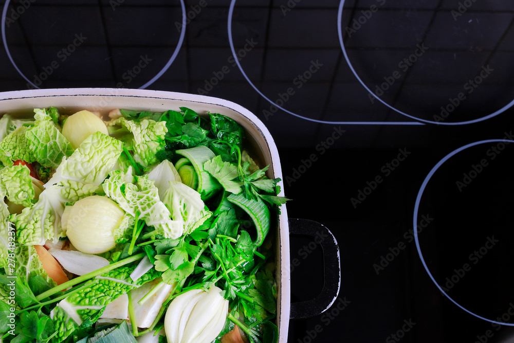 Sticker big pot with mixed vegetables on the stove.