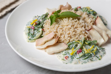Squid with brown rice and cucumber in yogurt dressing
