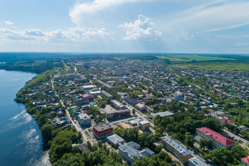 Rezh city and pond. Russia, Sverdlovsk region. Summer, sunny. Aerial