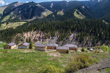 Several rural buildings in the mountains