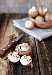  Brown mushrooms on old dark wooden background