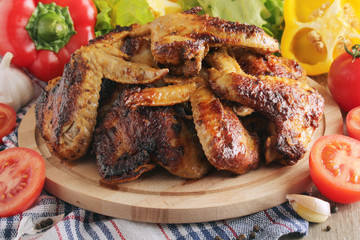 Chicken wings barbecue with different vegetables