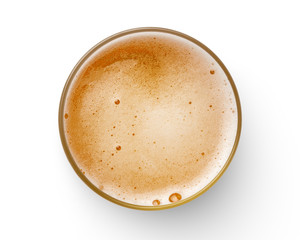 top view of beer bubbles in glass cup on white background.