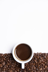 cup of coffee and beans on white background